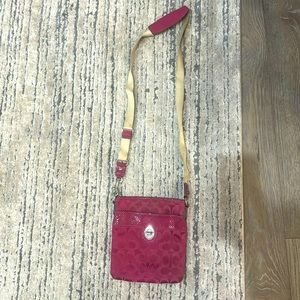 Pink Coach crossbody bag, used with some stains